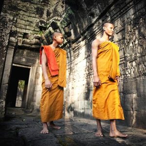 Angkor-Wat-Sunrise-tour-Semi-Private-Sunrise-Guided-Tour - Monks walking at the temples, a very common vies during Angkor Wat temple tours
