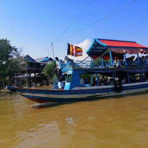 Boat ride through the floating village with your tour guide
