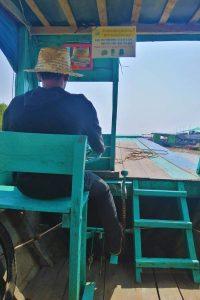 Stilted homes reflect in Tonle Sap's waters during our intimate 2.5-Day Siem Reap Journey village experience