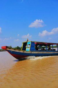 Stilted homes reflect in Tonle Sap's waters during our intimate 2.5-Day Siem Reap Journey village experience