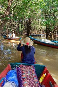 Young monks blessing visitors during Tonle Sap tour Siem Reap - authentic Cambodian moments