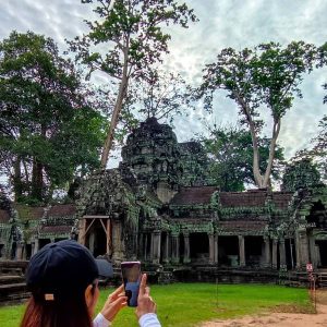 Experience the mystical embrace of ancient trees and temple ruins on our Late Morning Angkor Tour - Ta Prohm's massive roots