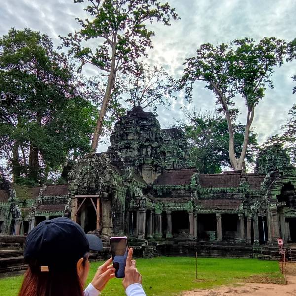 Experience the mystical embrace of ancient trees and temple ruins on our Late Morning Angkor Tour - Ta Prohm's massive roots