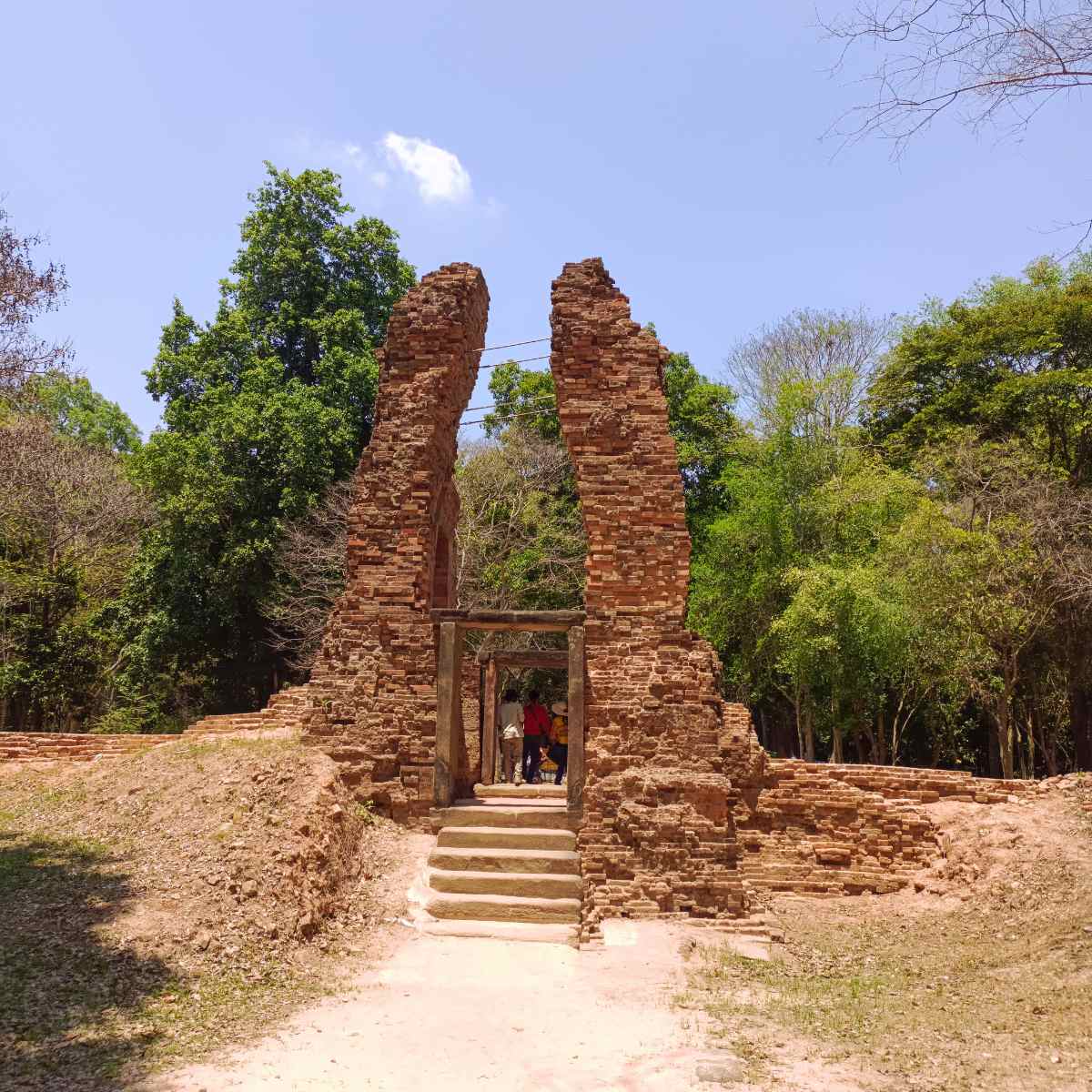 Ancient brick temple tower at Sambor Prei Kuk surrounded by forest, photographed during the Phnom Penh to Siem Reap private sightseeing transfer on this 5 days 4 nights Cambodia tour.