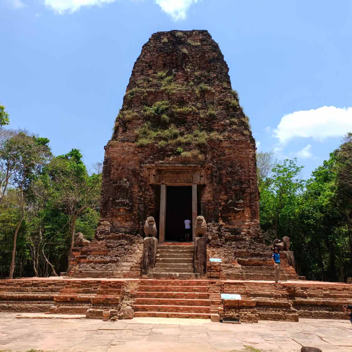 Front view of a tall ancient brick temple at Sambor Prei Kuk, shown as part of the private Phnom Penh to Siem Reap road transfer with sightseeing stops.